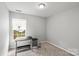 Bedroom featuring a desk near a window providing ample natural light at 13528 Philip Michael Rd, Huntersville, NC 28078