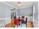 Dining room with hardwood floors, chandelier, and classic wainscoting open to the kitchen at 13528 Philip Michael Rd, Huntersville, NC 28078