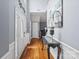 Welcoming foyer featuring hardwood floors, elegant wainscoting, and a decorative front door at 13528 Philip Michael Rd, Huntersville, NC 28078