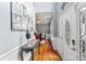 Welcoming foyer featuring hardwood floors, elegant wainscoting, and a decorative front door at 13528 Philip Michael Rd, Huntersville, NC 28078