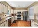 Modern kitchen equipped with stainless steel appliances and granite countertops at 13528 Philip Michael Rd, Huntersville, NC 28078