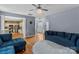 Spacious living room with hardwood floors and blue sofas at 13528 Philip Michael Rd, Huntersville, NC 28078