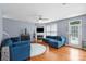 Comfortable living room with hardwood floors, a fireplace, and stylish blue sofas at 13528 Philip Michael Rd, Huntersville, NC 28078