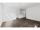 Bright bedroom featuring hardwood floors and a view of the upstairs hallway at 15208 Caspian Way, Charlotte, NC 28278