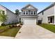 Charming two-story home with a two-car garage and nicely landscaped front yard at 15208 Caspian Way, Charlotte, NC 28278