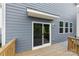 Exterior back door and siding of house and wooden deck at 15208 Caspian Way, Charlotte, NC 28278