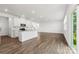 Contemporary kitchen with stainless appliances, island, and access to outdoor space at 15208 Caspian Way, Charlotte, NC 28278