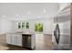 Bright, modern kitchen features stainless appliances, granite countertops, and a spacious layout at 15208 Caspian Way, Charlotte, NC 28278
