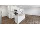 Stylish kitchen with an island, granite countertops, and modern stainless steel appliances at 15208 Caspian Way, Charlotte, NC 28278
