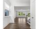 Bright living room boasts gleaming hardwood floors and plenty of natural light at 15208 Caspian Way, Charlotte, NC 28278