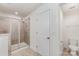 Bathroom featuring walk-in shower with glass door and toilet in separate area at 15524 Scholastic Dr, Charlotte, NC 28277