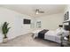 Bright bedroom with neutral walls, a modern ceiling fan, and a comfortable bed with a black and white color scheme at 15524 Scholastic Dr, Charlotte, NC 28277