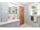 Bathroom with vanity, mirror, medicine cabinet, and window providing natural light at 158 Jane Sowers Rd, Statesville, NC 28625