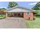 Exterior view of home featuring a carport, complete with a firewood rack and yard at 158 Jane Sowers Rd, Statesville, NC 28625