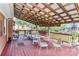 Relaxing covered deck featuring a stained wood floor, furniture, a ceiling fan, and a backyard view at 158 Jane Sowers Rd, Statesville, NC 28625