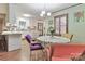 The dining area features an attractive chandelier, complemented by modern seating and a view of the kitchen at 158 Jane Sowers Rd, Statesville, NC 28625