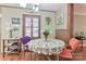 Cozy dining area features a round table with colorful chairs, under a modern chandelier at 158 Jane Sowers Rd, Statesville, NC 28625