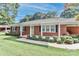 Classic brick home with a covered porch, offering curb appeal and a cozy entrance at 158 Jane Sowers Rd, Statesville, NC 28625
