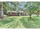Beautiful brick home featuring a lush lawn and established trees at 158 Jane Sowers Rd, Statesville, NC 28625