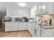 Bright kitchen featuring white cabinets, granite countertops, and stainless steel appliances at 158 Jane Sowers Rd, Statesville, NC 28625