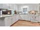 Bright kitchen featuring white cabinets, granite countertops, and stainless steel appliances at 158 Jane Sowers Rd, Statesville, NC 28625