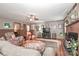 Spacious living room featuring a brick fireplace and wood floors. The room is warm and inviting at 158 Jane Sowers Rd, Statesville, NC 28625