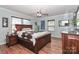 Spacious main bedroom with hardwood floors, a ceiling fan, and natural light at 158 Jane Sowers Rd, Statesville, NC 28625