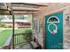 Playhouse entrance with teal door, vintage wood door, and wood porch at 158 Jane Sowers Rd, Statesville, NC 28625