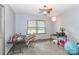 A nice room with two desks, a ceiling fan, and a large window, perfect for an office at 158 Jane Sowers Rd, Statesville, NC 28625
