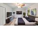 Spacious bedroom with TV, ceiling fan, large window and a luxury bed at 16512 Kimbolten Dr, Huntersville, NC 28078