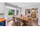 Cozy eat-in kitchen featuring a wood table with six chairs and ample natural light from the bay window at 16512 Kimbolten Dr, Huntersville, NC 28078