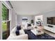 Bright, modern living room with white furniture, a large window, and an open concept layout for easy entertaining at 16512 Kimbolten Dr, Huntersville, NC 28078