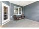 Relaxing screened-in porch with a wicker chair set to enjoy the outdoors at 1663 Tranquility Blvd, Lancaster, SC 29720