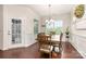 Elegant dining room featuring wood floors, traditional chair rail, and decorative chandelier at 1663 Tranquility Blvd, Lancaster, SC 29720