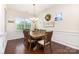 Elegant dining room featuring wood floors, traditional chair rail, and decorative chandelier at 1663 Tranquility Blvd, Lancaster, SC 29720