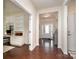 Inviting foyer featuring hardwood floors, glass paneled doors and entry with transom window at 1663 Tranquility Blvd, Lancaster, SC 29720