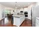 Open kitchen featuring granite countertops, stainless steel appliances, and seamless flow to dining area at 1663 Tranquility Blvd, Lancaster, SC 29720