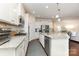 Modern kitchen showcasing granite countertops, stainless steel appliances, and ample cabinet space at 1663 Tranquility Blvd, Lancaster, SC 29720