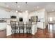 Bright kitchen with granite countertops, a large island with seating, and stainless steel appliances at 1663 Tranquility Blvd, Lancaster, SC 29720