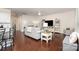 Open-concept living space featuring hardwood floors, comfortable seating, and easy access to the kitchen at 1663 Tranquility Blvd, Lancaster, SC 29720