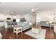 Inviting living room boasts hardwood floors, comfortable seating, and an open floor plan to the kitchen at 1663 Tranquility Blvd, Lancaster, SC 29720