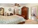 Cozy bedroom with a traditional wooden bed frame, ceiling fan, and view to an ensuite bathroom at 1720 Lowe Dr, Catawba, NC 28609