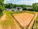 Aerial view of a fenced dog park area near RV and boat parking at 173 Morgans Branch Rd, Belmont, NC 28012