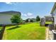 Beautiful backyard with a well-manicured lawn, privacy fence, and a wooden deck at 173 Morgans Branch Rd, Belmont, NC 28012