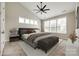 This spacious bedroom features a vaulted ceiling, fan, and lots of natural light from the many windows at 173 Morgans Branch Rd, Belmont, NC 28012