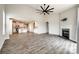 Open living space featuring hardwood floors, a fireplace, and a seamless connection to the kitchen at 173 Morgans Branch Rd, Belmont, NC 28012