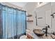 Bathroom with a bowl sink, vanity, and patterned shower curtain creating a modern and stylish space at 1849 Still Water Ln, Indian Land, SC 29707
