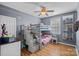 ' bedroom featuring a bunk bed with ladder access and decorative ceiling fan at 1849 Still Water Ln, Indian Land, SC 29707