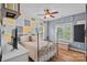 Comfortable bedroom with stylish decor, wooden floors, and plenty of natural light at 1849 Still Water Ln, Indian Land, SC 29707