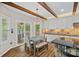 Cozy breakfast nook with wood beams and a view of the outdoor patio at 1849 Still Water Ln, Indian Land, SC 29707